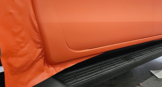 Matte orange Hilux and service body vinyl wrap by Baboon Studios Melbourne